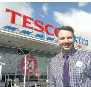  ??  ?? ●●Luke Saulino outside Tesco in Portwood where he will spend 50 hours locked in a glass box