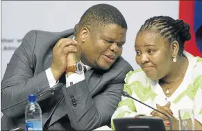  ?? Picture: TREVOR SAMSON ?? TEAM TALK: Ministers David Mahlobo and Nosiviwe Mapisa-Nqakula confer at the justice, crime prevention and security cluster briefing in Parliament, Cape Town, yesterday.