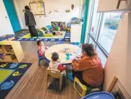  ?? U-T FILE ?? Children eat a snack at Children of the Rainbow Childcare Ser vices. About 12 percent of such providers in the county have closed because of the pandemic.