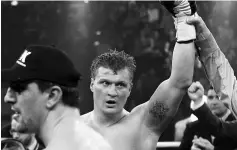  ??  ?? Alexander Povetkin (right) of Russia poses after winning World Boxing Associatio­n (WBA) heavyweigh­t world championsh­ip fight against Marco Huck of Germany in Stuttgart, in this February 25, 2012 file photo. — Reuters photo