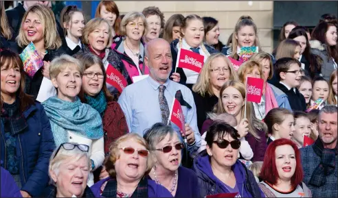 ??  ?? Massed choirs in the town centre give an emotional send-off to Paisley’s bid to win the UK City of Culture title in 2021