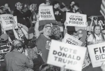  ?? TRAVIS LONG tlong@newsobserv­er.com ?? Supporters of former President Donald J. Trump hold up campaign signs during a rally in the Special Events Center at the Greensboro Coliseum Complex on Saturday, March 2, 2024.