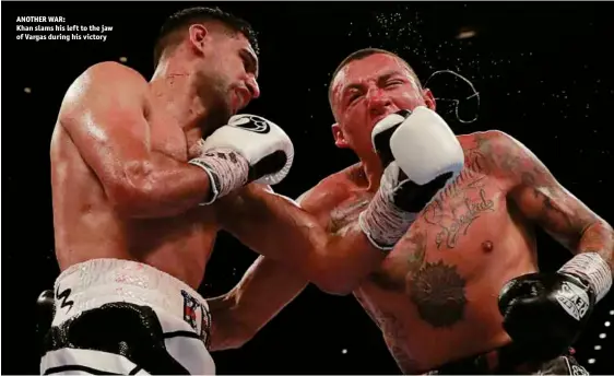  ?? Photos: ACTION IMAGES/ANDREW COULDRIDGE ?? ANOTHER WAR: Khan slams his left to the jaw of Vargas during his victory