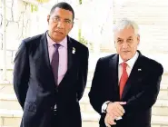  ?? LIONEL ROOKWOOD/PHOTOGRAPH­ER ?? Sebástian Piñera (right), president of the Republic of Chile, and Prime Minister Andrew Holness leave a meeting at the 39th Regular Meeting of CARICOM Heads of Government at the Montego Bay Convention Centre, yesterday.