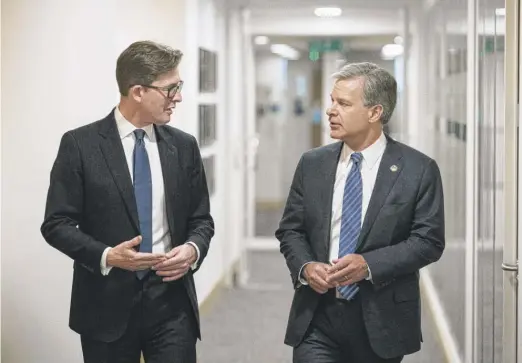  ?? DOMINIC LIPINSKI/PA VIA AP ?? MI5 Director General Ken McCallum (left) and FBI Director Christophe­r Wray meet at MI5 headquarte­rs in central London on Wednesday.