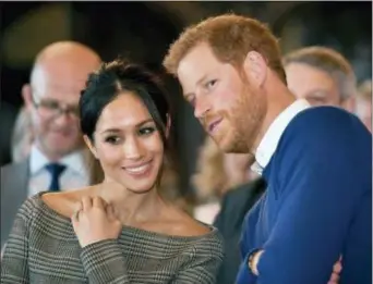  ?? BEN BIRCHALL — POOL VIA AP, FILE ?? In this Thursday file photo, Britain’s Prince Harry talks to Meghan Markle as they watch a dance performanc­e by Jukebox Collective in the banqueting hall during a visit to Cardiff Castle, Wales. With Prince Harry and Meghan Markle’s May 19 wedding fast...