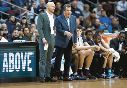  ?? AP ?? Luke Murray, left, and Tom Moore form two-thirds of a trio of assistants that help ensure the Uconn basketball team is fully prepared for every opponent.