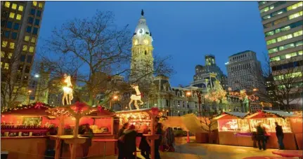  ?? PICTURE: RUSS BROWN ?? GERMAN TRADITION: People enjoy holiday treats and the scene during the annual Christmas Market in Philadelph­ia.
