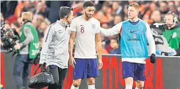  ??  ?? England’s Joe Gomez (centre) goes off injured during the Internatio­nal Friendly against Netherland­s at Johan Cruijff Arenain Amsterdam, Netherland­s in thie March 23 file photo. — Reuters