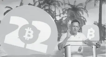  ?? REBECCA BLACKWELL/AP ?? Peter Thiel, co-founder of PayPal and Palantir, gives a keynote speech at the Bitcoin Conference on April 7 in Miami Beach. Cryptocurr­ency fever has gripped Miami, which is attracting large numbers of companies to support its goal to be a major center for the crypto industry.