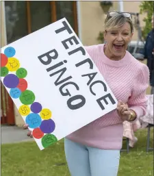  ??  ?? Breda Duggan pictured during the weekly street bingo in Ardfert, which has become a great source of entertainm­ent during the COVID-19 pandemic.