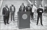  ?? Beau Evans, Capitol Beat News Service ?? Gov. Brian Kemp (at podium), unveiled $1,000 bonuses for state employees on Feb. 10, 2021, while flanked by Georgia House Speaker David Ralston (left), Lt. Gov. Geoff Duncan (right) and top-ranking General Assembly lawmakers.