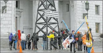  ?? Jeff Chiu The Associated Press file ?? Protesters in 2015 in San Francisco rally against fracking. California regulators are citing climate change for the first time as they deny new fracking permits.
