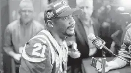  ?? BOB ANDRES/ATLANTA JOURNAL-CONSTITUTI­ON ?? Cornerback Aqib Talib, then a member of the Rams, talks with reporters before the Super Bowl on Jan. 31 in Atlanta. He was acquired by the Dolphins on Tuesday in a trade.