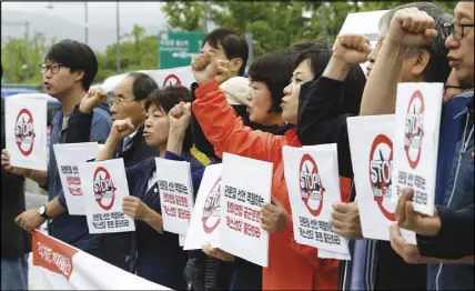  ?? AP PHOTO ?? South Korean protesters shout slogans during a rally against the Max Thunder joint military exercise between the United States amd South Korea near the U.S. embassy in Seoul yesterday.