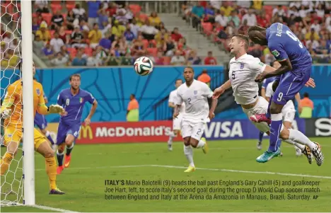  ?? AP ?? ITALY’S Mario Balotelli (9) heads the ball past England’s Gary Cahill (5) and goalkeeper Joe Hart, left, to score Italy’s second goal during the group D World Cup soccer match between England and Italy at the Arena da Amazonia in Manaus, Brazil,...