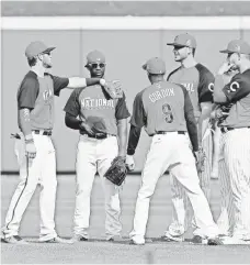  ?? RICK OSENTOSKI, USA TODAY SPORTS ?? From left, Bryce Harper, Andrew McCutchen, Dee Gordon, Kris Bryant and Anthony Rizzo talk during All-Star workouts.