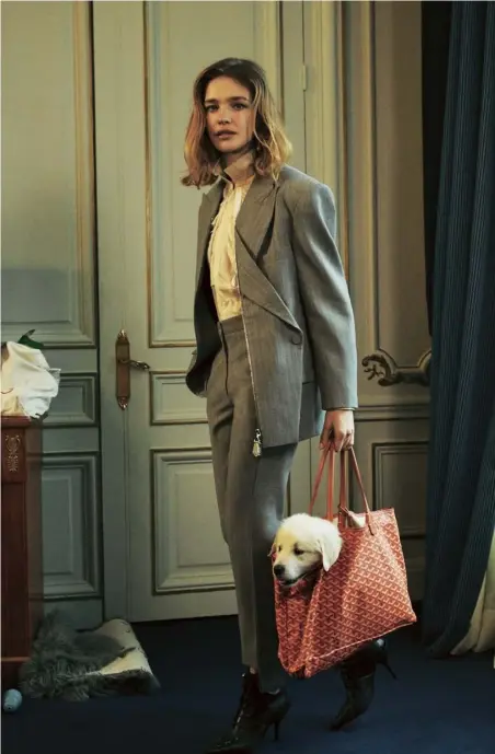  ??  ?? Left Wool zip-up blazer, £2,620, matching straight-leg trousers, £1,225, shirt, £1,490, and leather ankle boots, £1,080, all Louis Vuitton (louisvuitt­on.com). 18ct-gold and diamond hoop earring, £498, Stone Paris (stoneparis.com). Leather Goyard bag, Natalia’s own