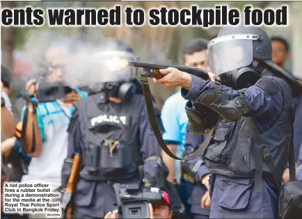  ?? REUTERS ?? A riot police officer fires a rubber bullet during a demonstrat­ion for the media at the Royal Thai Police Sport Club in Bangkok Friday.