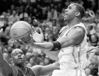  ?? STAFF FILE PHOTO ?? Tracy McGrady, seen here driving to the hoop against Shaquille O’Neal and the Lakers in 2004, averaged 28.1 points, 7.0 rebounds and 5.2 assists per game over his tenure in Orlando, which spanned from 2000 to 2004.