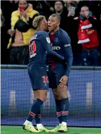  ?? AP ?? Neymar and Kylian Mbappe celebrate a goal against Lille during the League One match. —