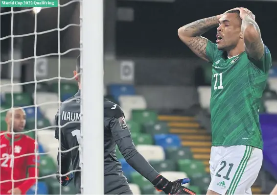  ?? COLM LENAGAHAN/PACEMAKER ?? So close:
Josh Magennis holds his head in his hands after another missed chance for Northern Ireland last night