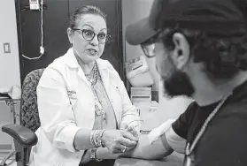  ?? Ronald Cortes / Contributo­r ?? Rose Ann Barajas, of UT Health San Antonio, meets with Joseph Leal, 21, who has has dealt with the steady progressio­n of his Type 2 diabetes since he was 9.