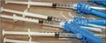  ?? PATRICK T. FALLON/AFP VIA GETTY IMAGES/TNS ?? Syringes with doses of the Johnson & Johnson COVID-19 vaccine await recipients in Los Angeles. More and more states are making vaccines available to all adults.