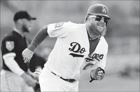  ?? Carlos Osorio Associated Press ?? JUSTIN TURNER is unlikely to play for the Dodgers until May, at the earliest. Logan Forsythe will be his primary replacemen­t at third.