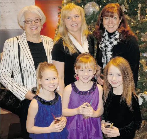  ?? Photos: Caroline Gault/ Edmonton Journal ?? From left, Minnie Proc joins Wanda Sparrow and Christine Beamish with their daughters Paige and Paris Sparrow and Annika Beamish at the Alberta Ballet’s matinee performanc­e of the The Nutcracker on Saturday, Dec. 15, at the Jubilee Auditorium.