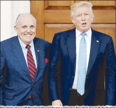  ?? AP ?? File photo shows US President Donald Trump and former New York mayor Rudy Giuliani attending a charity event in New Jersey.