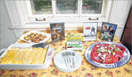  ?? MICHAEL SEARS / MSEARS@JOURNALSEN­TINEL.COM ?? This movie night theme dishes are creamy roast vegetable enchiladas, fresh tomato salad with onions, feta and olives, and chocolate-dipped frozen banana bites.