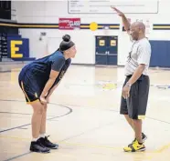  ?? ROBERTO E. ROSALES/JOURNAL ?? Highland High freshman Cailee Crawford, left, receives instructio­n from coach Lonnie Neal. Crawford, a 6-foot point guard, already has a scholarshi­p offer from Clemson.