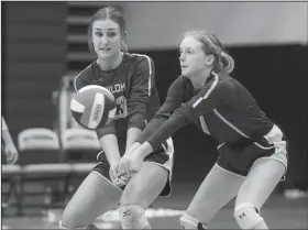  ?? NWA Democrat-Gazette/CHARLIE KAIJO ?? Shiloh Christian High School’s Lexi Richards (23) and Kassie Boyett (1) dig during a championsh­ip match of the 4A-1 Conference volleyball tournament Thursday against Harrison High School.