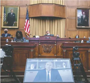  ?? GRAEME JENNINGS/POOL VIA REUTERS ?? Amazon CEO Jeff Bezos faces questions from the anti-trust sub-committee via video conference during a hearing in Washington, D.C., on Wednesday. His company, Facebook, Apple and Google have rebuffed suggestion­s they are emulating the early railroad monopolies by abusing their market power.