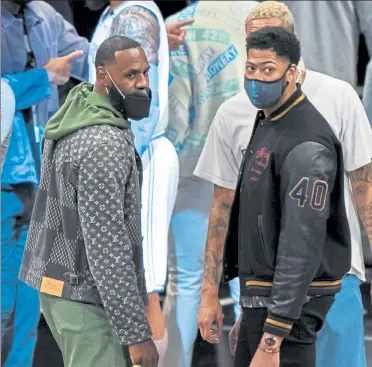  ?? AP ?? Los Angeles Lakers stars LeBron James and Anthony Davis look on during Saturday’s game against the Brooklyn Nets.