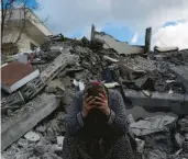  ?? KHALIL HAMRA/AP ?? A distraught woman sits on rubble Tuesday in Nurdagi, a Turkish town near the earthquake’s epicenter.