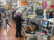  ?? KARA DRISCOLL / STAFF ?? A customer uses self checkout at a Kroger store recently in the Dayton region.