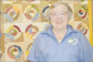  ?? (NWA Democrat-Gazette/Rachel Dickerson) ?? Jean Justice of Bella Vista is pictured with a quilt she made. Quilting is one of several interests she pursues.