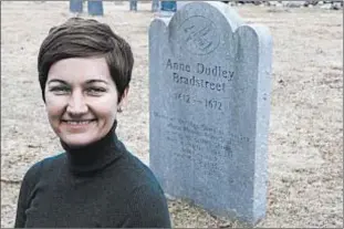  ?? AP ?? Merrimack College’s Christy Pottroff is searching for 17th century poet Anne Bradstreet’s burial site. Marker (above) is a commemorat­ive stone.