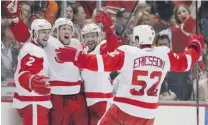  ?? JEFF GROSS/ GETTY IMAGES ?? Justin Abdelkader, Brendan Smith, Pavel Datsyuk and Jonathan Ericsson of the Detroit Red Wings celebrate Abdelkader’s goal in the first period against the Anaheim Ducks.