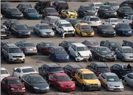  ?? The Canadian Press ?? Damaged vehicles are parked at the Insurance Corporatio­n of British Columbia’s Lower Mainland salvage yard in New Westminste­r.