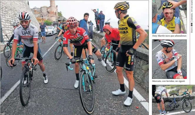  ??  ?? PELIGRO. Roglic toma la bici de un compañero tras la caída masiva en Escalona en la que se vio envuelto junto a otros favoritos.
Tony Martin tuvo que abandonar.
Marcato, con heridas, no siguió.
Richeze, con la pierna abrasada.