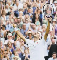 ?? Ben Curtis / Associated Press ?? Roger Federer celebrates defeating Rafael Nadal in their semifinal Friday at Wimbledon.
