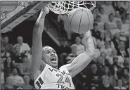  ?? AP/LEE LUTHER JR. ?? Virginia Tech forward Kerry Blackshear Jr. dunks the basketball Tuesday during the second half of the No. 20 Hokies’ 77-72 victory over the No. 3 Duke Blue Devils in Blacksburg, Va. Blackshear finished with 23 points and 10 rebounds.