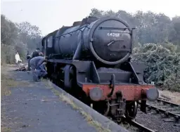  ?? BILL PIGGOTT ?? With the smokebox ash from the ‘Fifteen Guinea Special’ still on its front running plate – but already minus its chimney – No. 44781 sits in the former Saffron Walden branch platform at Bartlow in September 1968, before being shunted into position and craned off the track a few yards further on for the filming of The Virgin Soldiers. It is just standing within Essex, the county boundary with Cambridges­hire bisecting the branch platform.