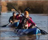  ??  ?? These kayakers were able to make headway along the flooded A1101 in Welney, Norfolk