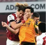  ??  ?? SHATTERING: Luiz and Jimenez head clash