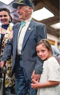  ?? GABRIELA CAMPOS/THE NEW MEXICAN ?? Andy Borrego, 6, hugs her great-grandfathe­r, Placido Borrego, following a ceremony honoring him Wednesday at City Hall.