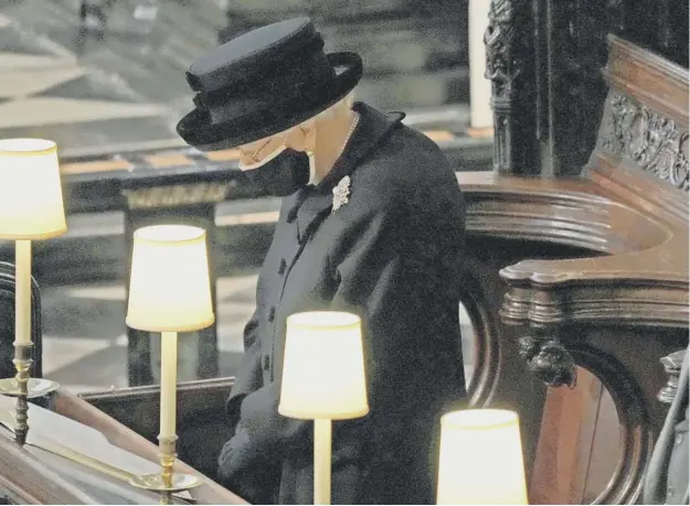  ?? PHOTO: GETTY ?? The Queen in her seat in the ancient carved wooden stalls of St George’s Chapel.